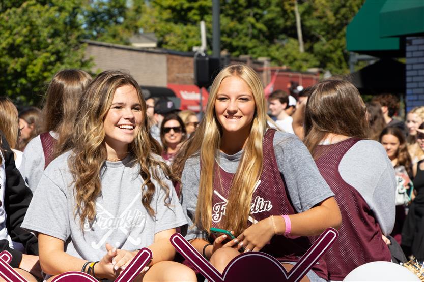 Girls smile on a homecoming float